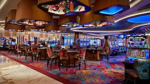 65 ph fish game lobby showing multiple shooting game rooms on a smartphone